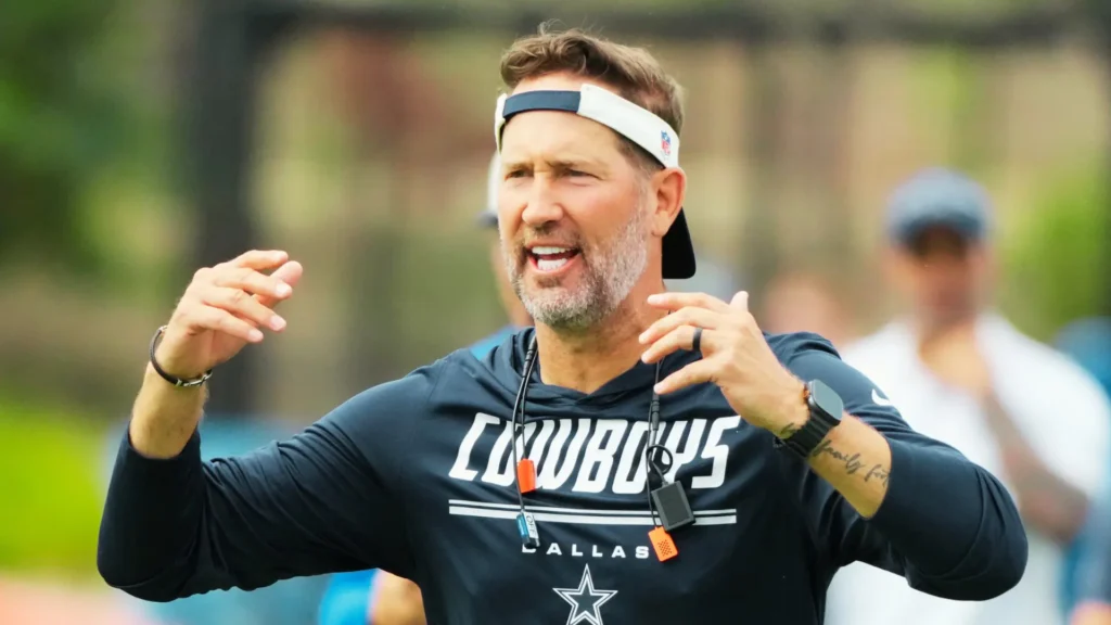 Dallas Cowboys head coach Brian Schottenheimer reacts during a joint practice against the Los Angeles Rams at the Rams Practice Facility.