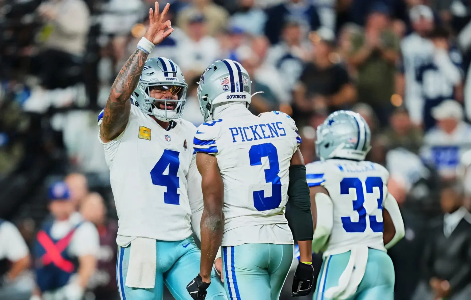 Dak Prescott #4 of the Dallas Cowboys celebrates after scoring a touchdown with teammate George Pickens #3 against the Las Vegas Raiders during an NFL football game at Allegiant Stadium on November 17, 2025 in Las Vegas, Nevada.