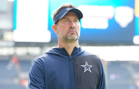 Head coach Brian Schottenheimer of the Dallas Cowboys looks on prior to an NFL football game against the Chicago Bears at Solider Field in Chicago, Illinois.