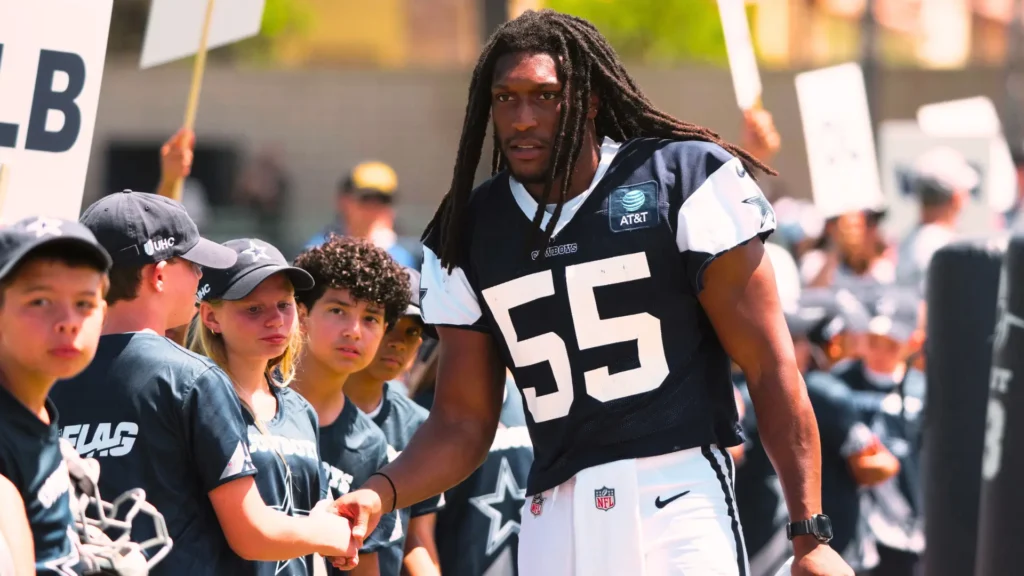 Dallas Cowboys linebacker Jaishawn Barham (55) greets fans at training camp at River Ridge Playing Fields.